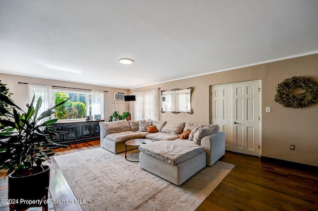 living room with ornamental molding and dark wood-type flooring