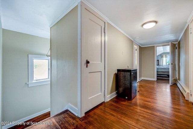 hallway featuring crown molding, dark hardwood / wood-style flooring, and a baseboard radiator