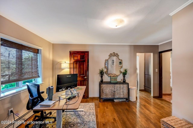 office area featuring wood-type flooring, ornamental molding, and a baseboard radiator