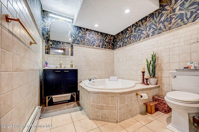 bathroom featuring tile patterned floors, tiled tub, a textured ceiling, and toilet