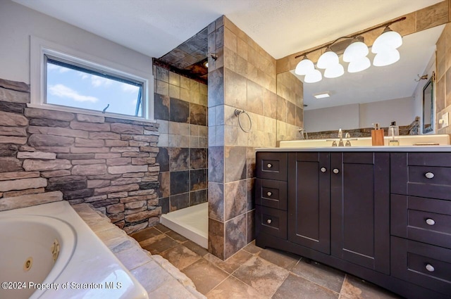 bathroom featuring vanity, tile walls, and independent shower and bath