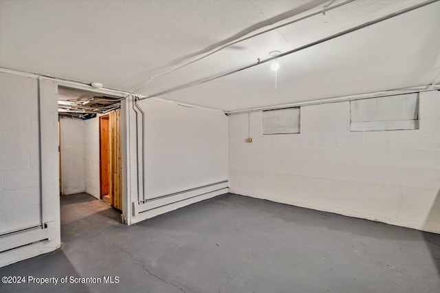 basement featuring a baseboard radiator