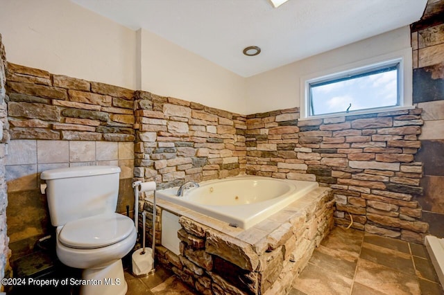 bathroom featuring a bathing tub and toilet