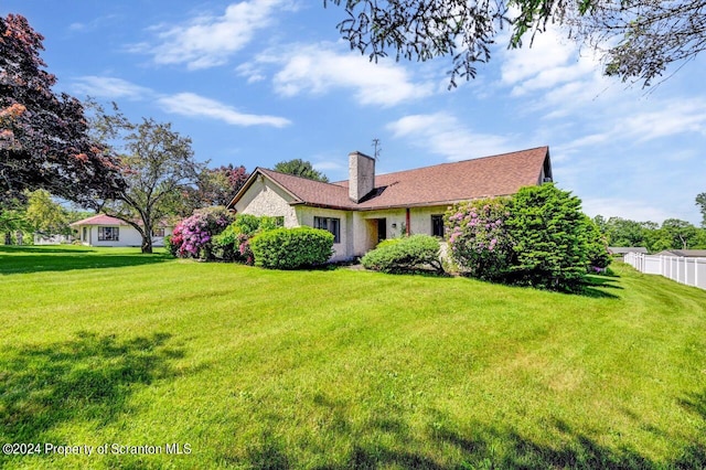 exterior space with a front lawn