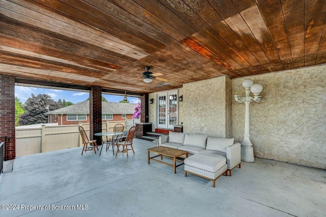 view of patio with french doors, an outdoor living space, and ceiling fan