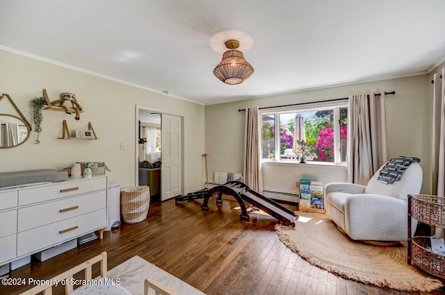 sitting room with dark hardwood / wood-style floors, ornamental molding, and a baseboard heating unit