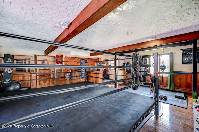 workout area featuring wood-type flooring