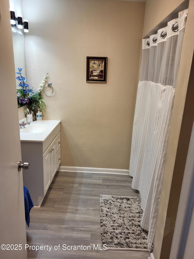 134 Taroli St, Old Forge, PA 18518 - bathroom with vanity, wood finished floors, and baseboards