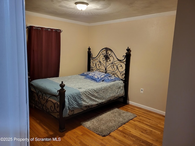 134 Taroli St, Old Forge, PA 18518 - bedroom featuring wood finished floors, ornamental molding, and baseboards