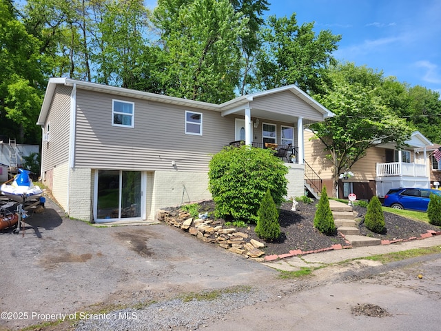 134 Taroli St, Old Forge, PA 18518 - view of front of house featuring covered porch and stairs