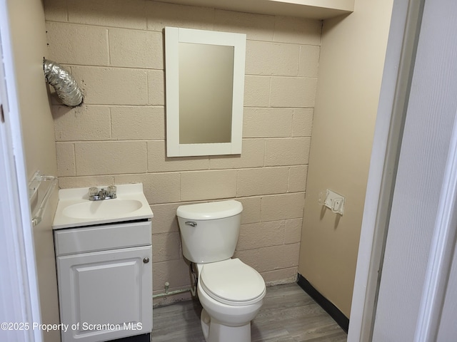 134 Taroli St, Old Forge, PA 18518 - half bath featuring vanity, wood finished floors, and toilet
