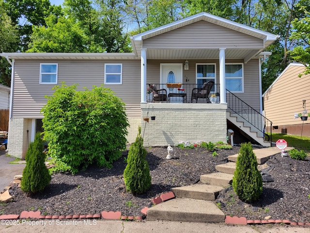 134 Taroli St, Old Forge, PA 18518 - view of front of house with stairway and a porch