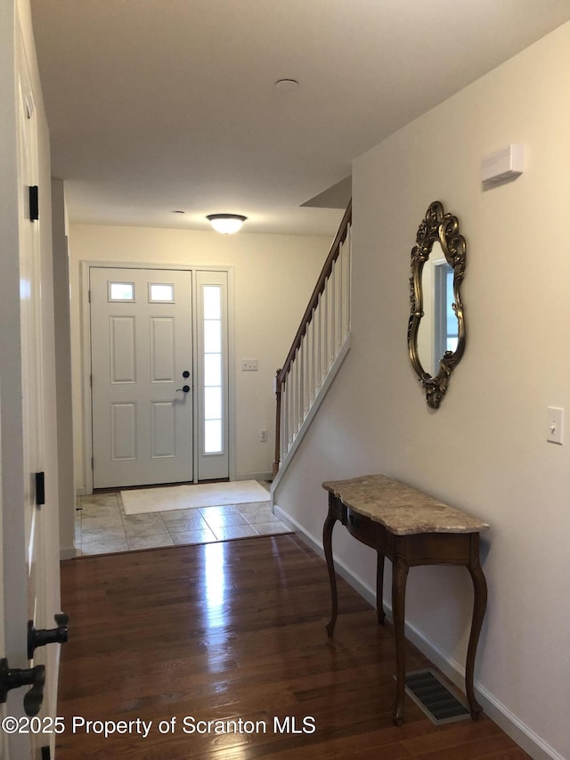 foyer with light hardwood / wood-style flooring