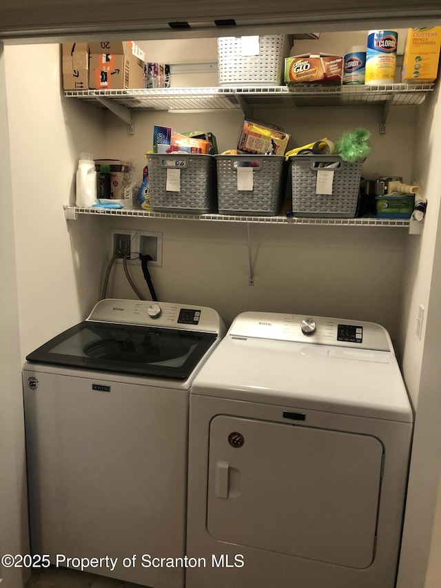 laundry room with independent washer and dryer