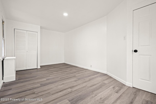 810 Pittston Ave, Scranton, PA 18505 - unfurnished bedroom featuring wood finished floors, recessed lighting, and a closet