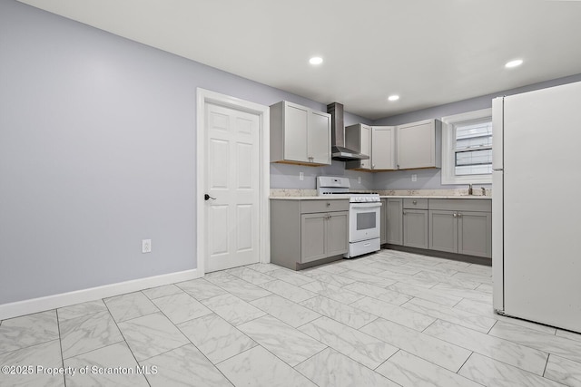 810 Pittston Ave, Scranton, PA 18505 - kitchen with white appliances, wall chimney exhaust hood, gray cabinets, light countertops, and light marble finish flooring