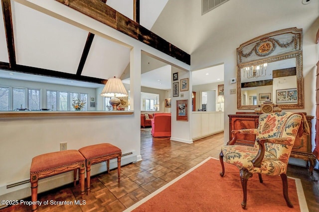 living area with high vaulted ceiling, baseboards, tile patterned flooring, visible vents, and recessed lighting