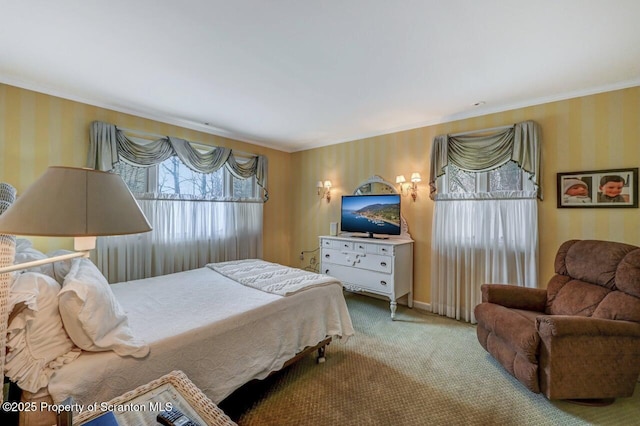 bedroom featuring carpet floors, ornamental molding, and wallpapered walls