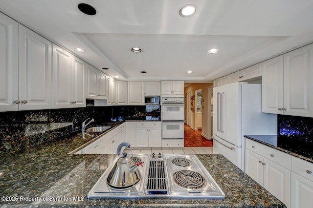 kitchen featuring a sink, recessed lighting, appliances with stainless steel finishes, and tasteful backsplash
