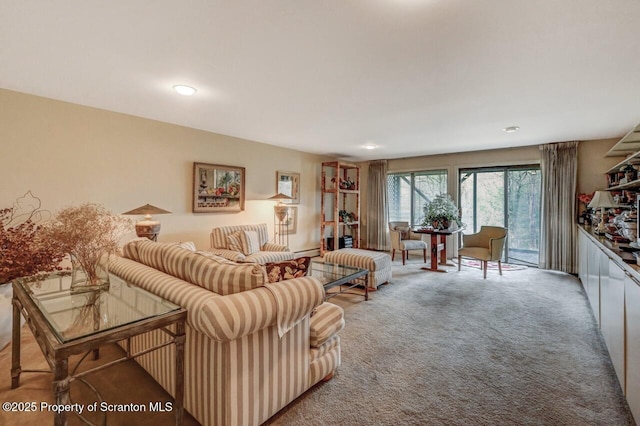 carpeted living area with recessed lighting