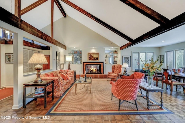 tiled living room with beamed ceiling, a fireplace, baseboards, and high vaulted ceiling
