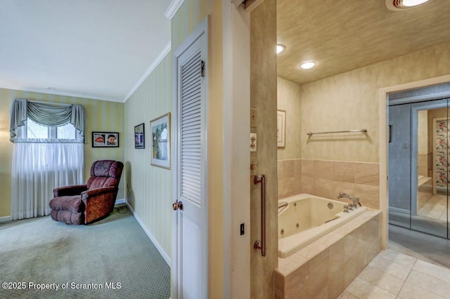 bathroom featuring tile patterned flooring, a jetted tub, crown molding, and baseboards