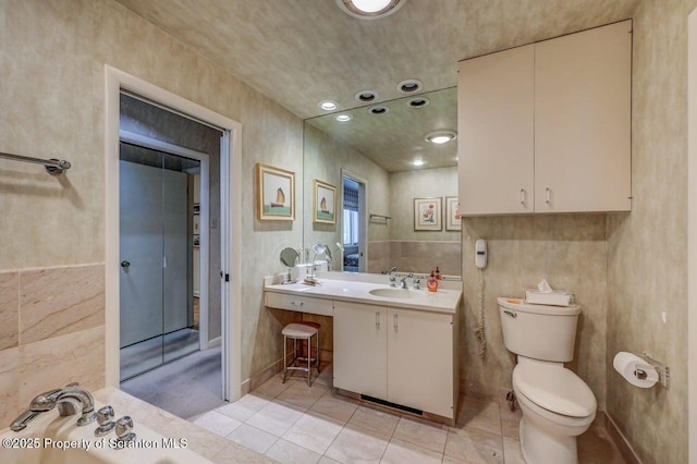 full bathroom featuring tile patterned flooring, vanity, and toilet