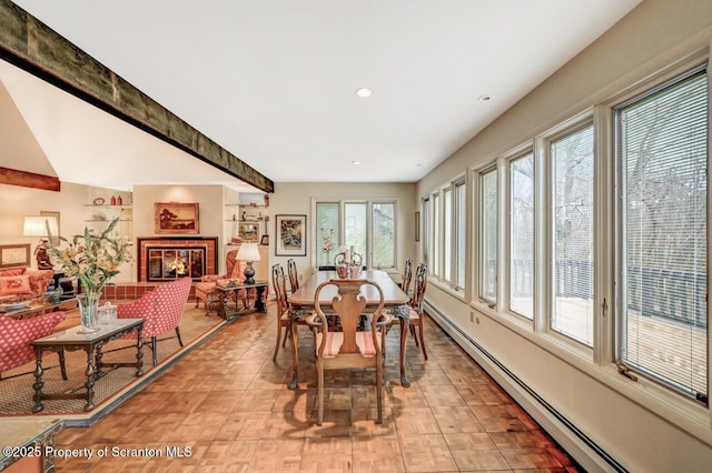 dining room featuring a baseboard heating unit and recessed lighting