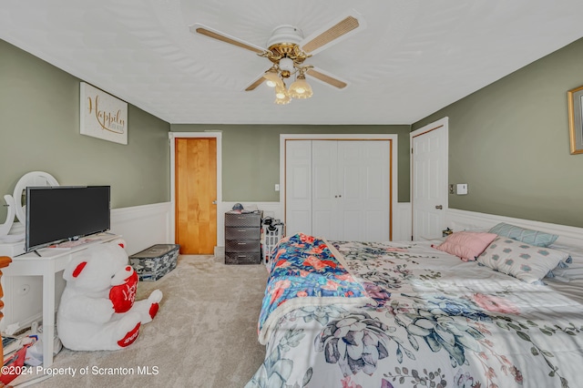 bedroom featuring ceiling fan and light colored carpet