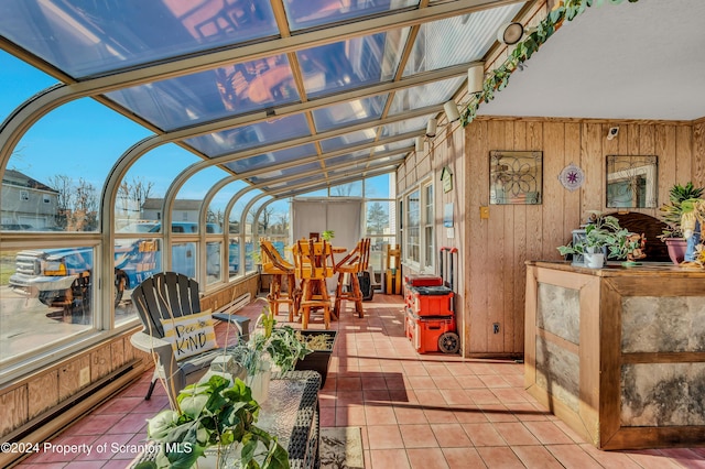 sunroom with lofted ceiling