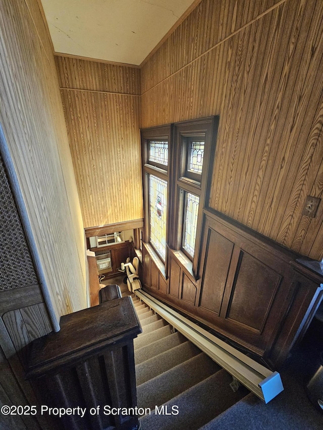 stairs with wood walls