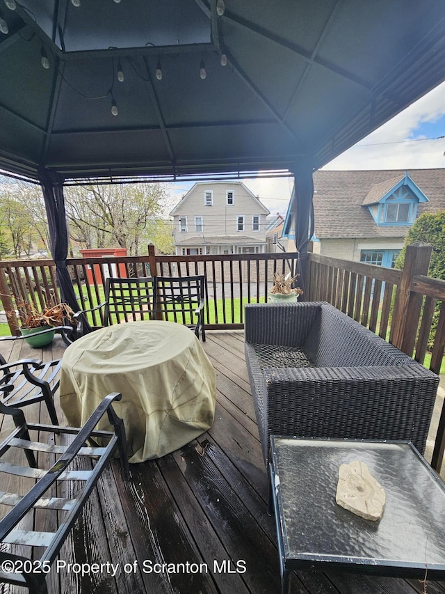 wooden deck with a gazebo