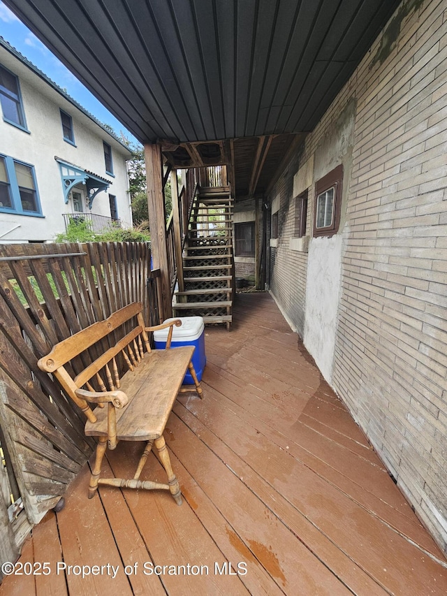 wooden terrace featuring stairs