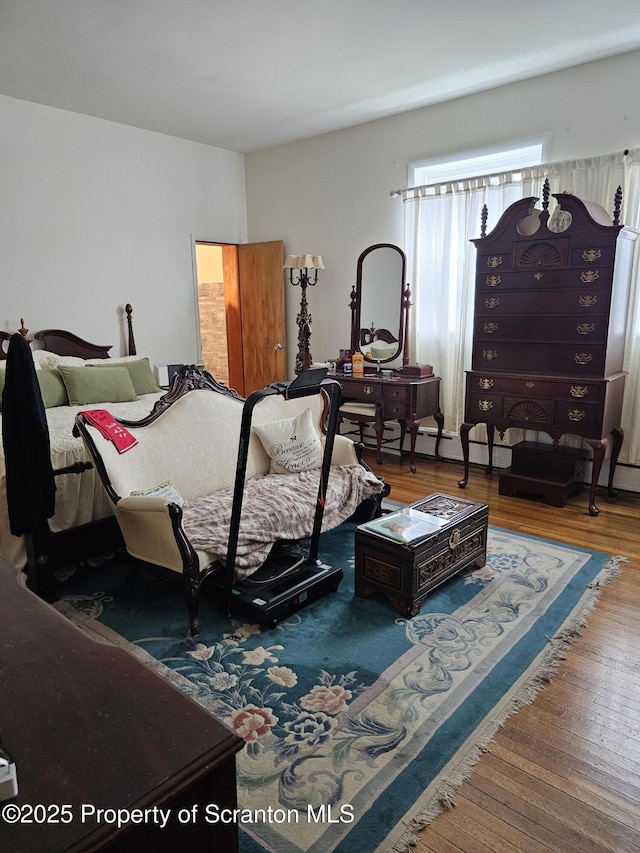 bedroom with wood finished floors
