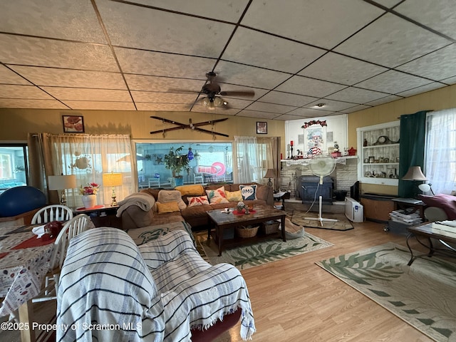 298 Crosstown Hwy, Union Dale, PA 18470 - living area featuring wood finished floors, a fireplace, and a ceiling fan