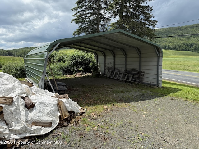298 Crosstown Hwy, Union Dale, PA 18470 - view of car parking with a carport and driveway