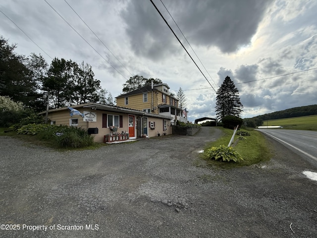 298 Crosstown Hwy, Union Dale, PA 18470 - view of front of property featuring gravel driveway and stucco siding