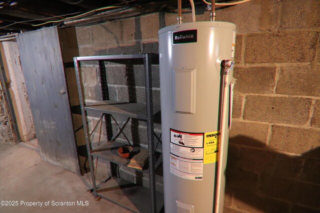 utility room featuring water heater