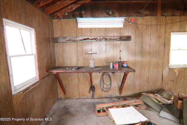 interior space featuring wooden walls