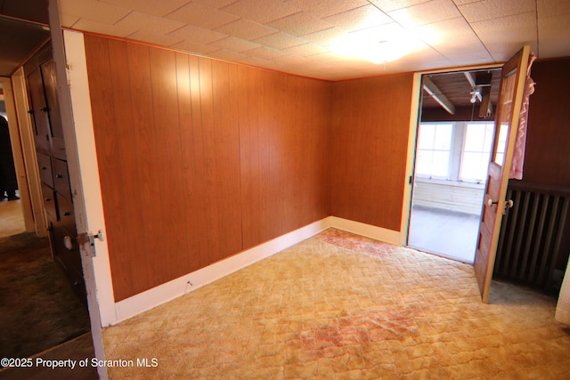 spare room with wooden walls