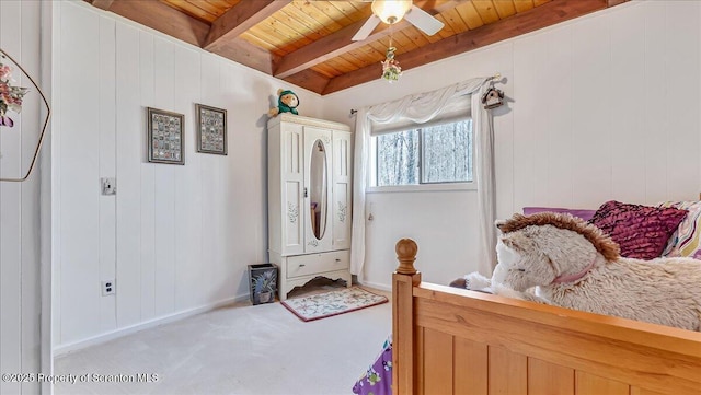 141 Cove Point Cir, Lakeville, PA 18438 - carpeted bedroom with wooden ceiling with exposed beams, baseboards, ceiling fan, and wood walls