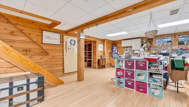 141 Cove Point Cir, Lakeville, PA 18438 - playroom with a paneled ceiling, wood walls, and wood finished floors