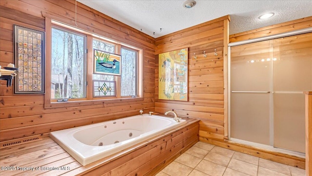 141 Cove Point Cir, Lakeville, PA 18438 - full bathroom with a textured ceiling, a shower stall, a tub with jets, wood walls, and tile patterned floors