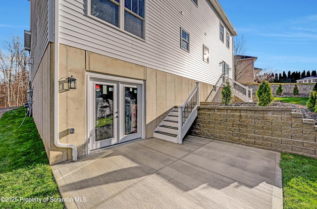 back of house featuring a patio area and stairway