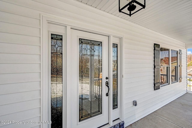 doorway to property featuring a porch