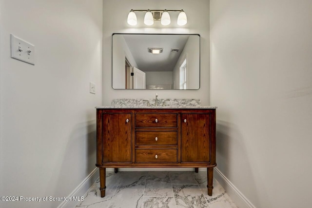 bathroom with marble finish floor, visible vents, baseboards, and vanity