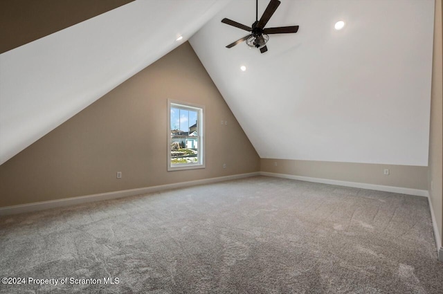 additional living space with carpet floors, recessed lighting, vaulted ceiling, and baseboards