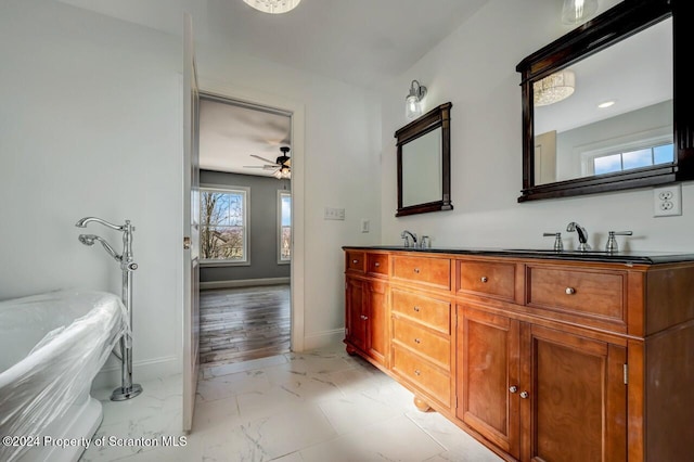 bathroom with vanity and ceiling fan