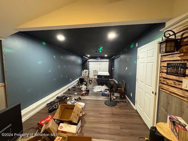 miscellaneous room with dark wood-type flooring