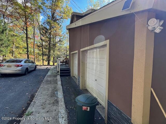 view of property exterior featuring a garage